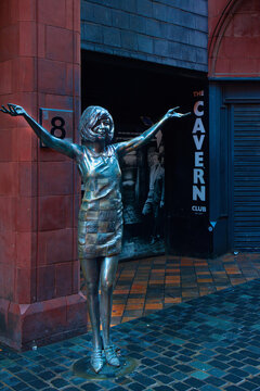 England, Liverpool - December 28, 2023: Cilia Black statue in front of the original Cavern Club in Mathew Street.