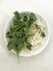 Chou dish 2 types of vegetables,  basil leaves, bean sprouts, eat to add nutritional value to the body.in Ceramic Bowl.