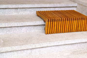 Wooden lining on stone steps for sitting