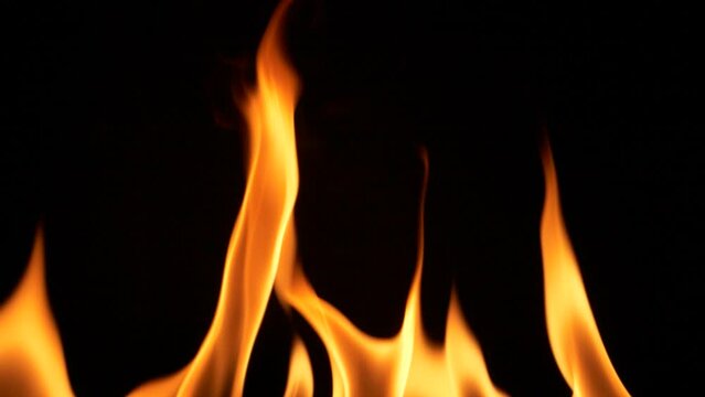Super slow motion of abstract fire flames isolated on black background burning
