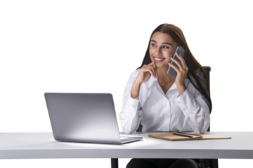 A woman smiles while talking on the phone, with a laptop on the table in front of her, against a white background, depicting a business concept
