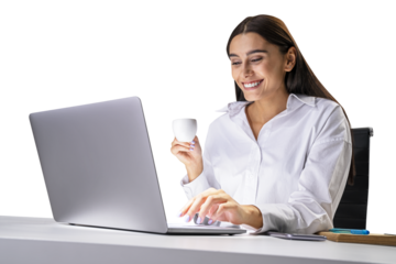 A smiling woman holding a coffee cup while working at a laptop on a white table, isolated on a white background, concept of business