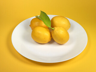 lemons in a dish - 783560587
