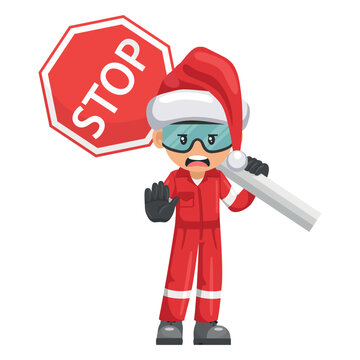 Annoyed industrial mechanic worker with Santa Claus hat with stop sign. Engineer with his personal protective equipment. Safety first. Industrial safety and occupational health at work