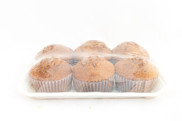 Cupcakes in a sealed plastic pack on white isolated background