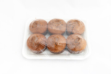Muffins cakes package on white isolated background