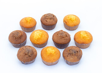 Homemade fresh cupcakes on white background. Top view.