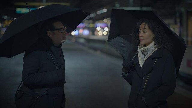 Couple Arguing Talking Angry At Train Station at Night