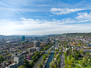 Aerial view of Swiss City of Zürich with cityscape and skyline on a sunny spring day. Photo taken April 12th, 2024, Zurich, Switzerland. - obrazy, fototapety, plakaty