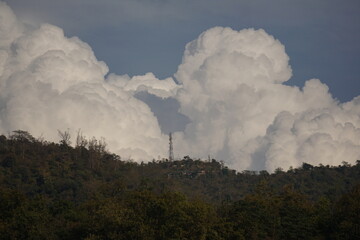 clouds over the sky behind the mountain