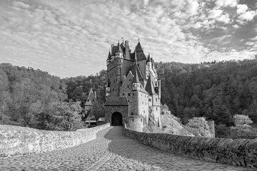 old castle in the forest in black white photo style 
