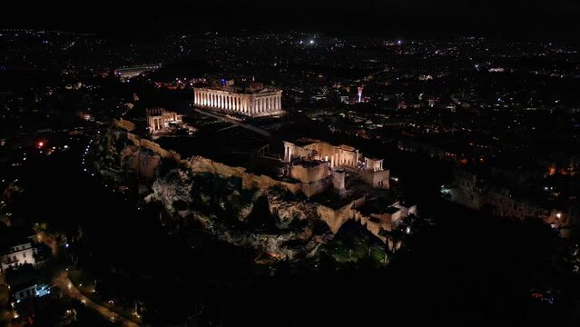 Acropolis in Greece by night , Parthenon in Athens drone aerial view, famous Greek tourist attraction, Ancient Greece landmark drone view - sigthseeing destination Unesco Heritage world in Atene 