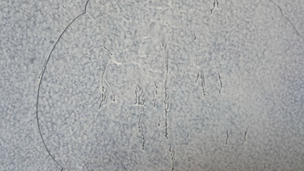 the walls of the house are white with fine cracks