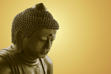Peace Buddha statue. Zen Buddha isolated copy space orange color tone.
