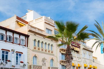 Foto auf Leinwand Häuserzeile an der Strandpromenade in Sitges, Spanien © Robert Poorten