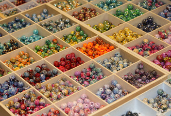 colored beads ideal for adorning necklaces and personalizing them in the hobby shop