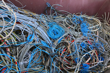 quantity of used electrical wires in the recycling container for the recycling of material and copper to safeguard the environment - 783596570