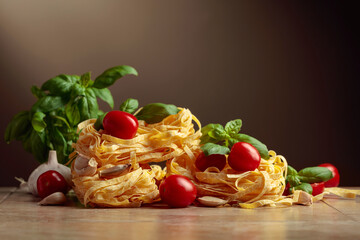 Homemade raw pasta with tomato, garlic, and basil.