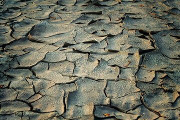 Cracked red earth in the quarry, the texture of earth during drought. A long time without rain. 