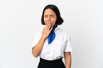 Airplane stewardess over isolated background yawning and covering wide open mouth with hand