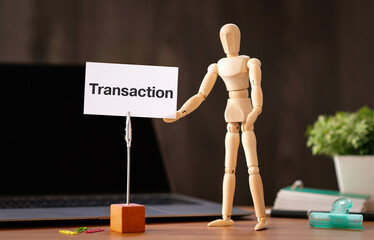 There is word card with the word Transaction. It is as an eye-catching image.