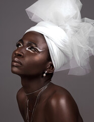 Profile, model and black woman with makeup, wrap and confidence in studio on grey background....