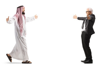 Full length profile shot of a saudi arab man meeting a mature businessman