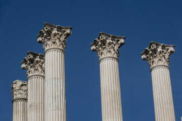 Ancient Roman columns isolated over blue sky, in Córdoba, Andalusia, Spain