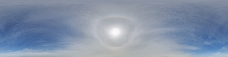 clear blue sky with halo sun in 360 hdri panorama view with zenith in seamless equirectangular...