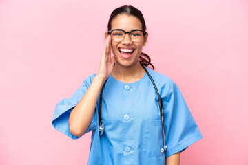 Young nurse Colombian woman isolated on pink background with surprise and shocked facial expression