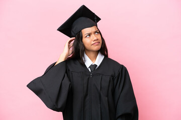Young university Colombian woman graduate isolated on pink background having doubts and with...