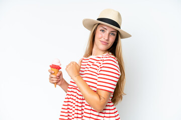 Young caucasian woman holding a cornet ice cream isolated on white background proud and self-satisfied