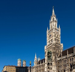 Fototapeta na wymiar Scenic view of the New town hall Building in Munich on a blue clear sky background