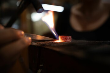 Closeup of forging a silver ring at the smith