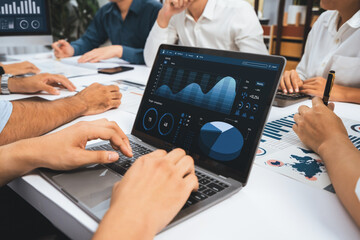 Analyst team uses BI Fintech display laptop to analyze financial data . Business people analyze BI...