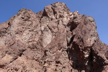 Closeup of the red rock canyon under blue sky taken in Nevada