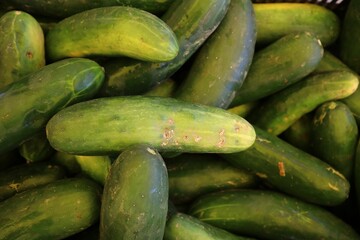 Top view of stack of cucumbers at a farmer's market
