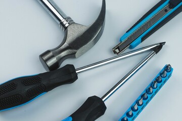 Closeup view of a set of black and blue tools isolated on a white background