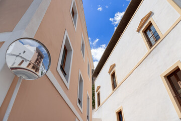 In the hear Eivissa town in Ibiza, a convex street mirror creates a captivating blend of reality...