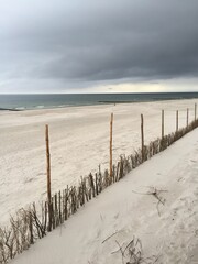 Vertical shot of the Baltic sea from a dune in a cloudy weather