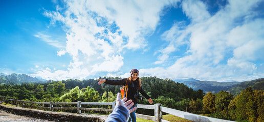 couple asians travel nature in the holiday. Hold hands running happy enjoy nature on the mountain...