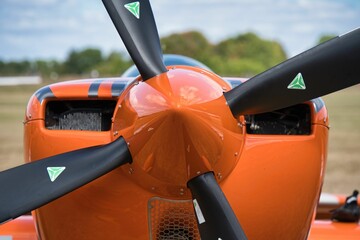 Back view of propeller of orange plane