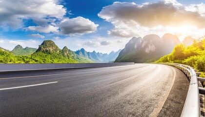 Asphalt highway road and green mountains with sky clouds nature landscape in the morning 