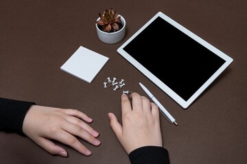 Woman Hand Holding Blank Notes Writing New Messege Updates Next To Tablet.