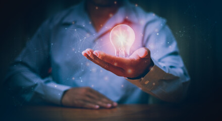 Businessman hands holding light bulb for Concept new idea, concept with innovation and inspiration,...
