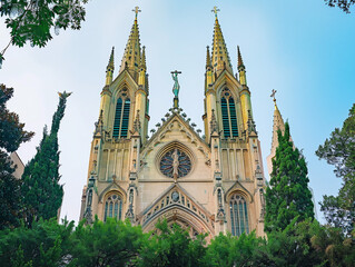 Fototapeta na wymiar Grand Catholic cathedral with towering spires, intricate details, and a sense of awe-inspiring reverence.