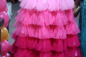 close up of pink color frill frock- party wear