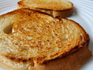 Closeup shot of details on toasted bread on a plate