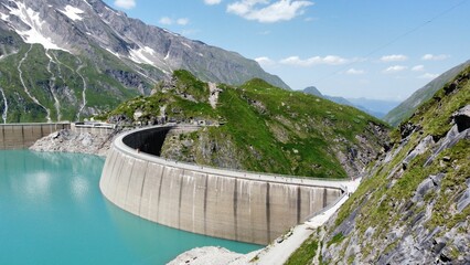 Picturesque turquoise Kaprun dam, high mountain reservoir in the Alpine mountains in Austria