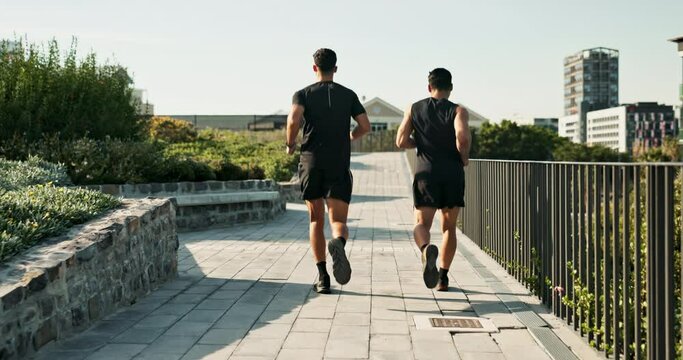 Outdoor, men and running for sports, morning and jogging for exercise with fitness in park. Cardio, athlete and runner with workout, training and wellness for healthcare of male person and back view